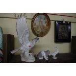 A large Lladro style eagle, 37cm high; together with a Lladro dog and another Lladro goose.