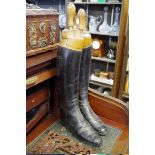 A pair of vintage black leather riding boots, approx size 8, with wooden trees.