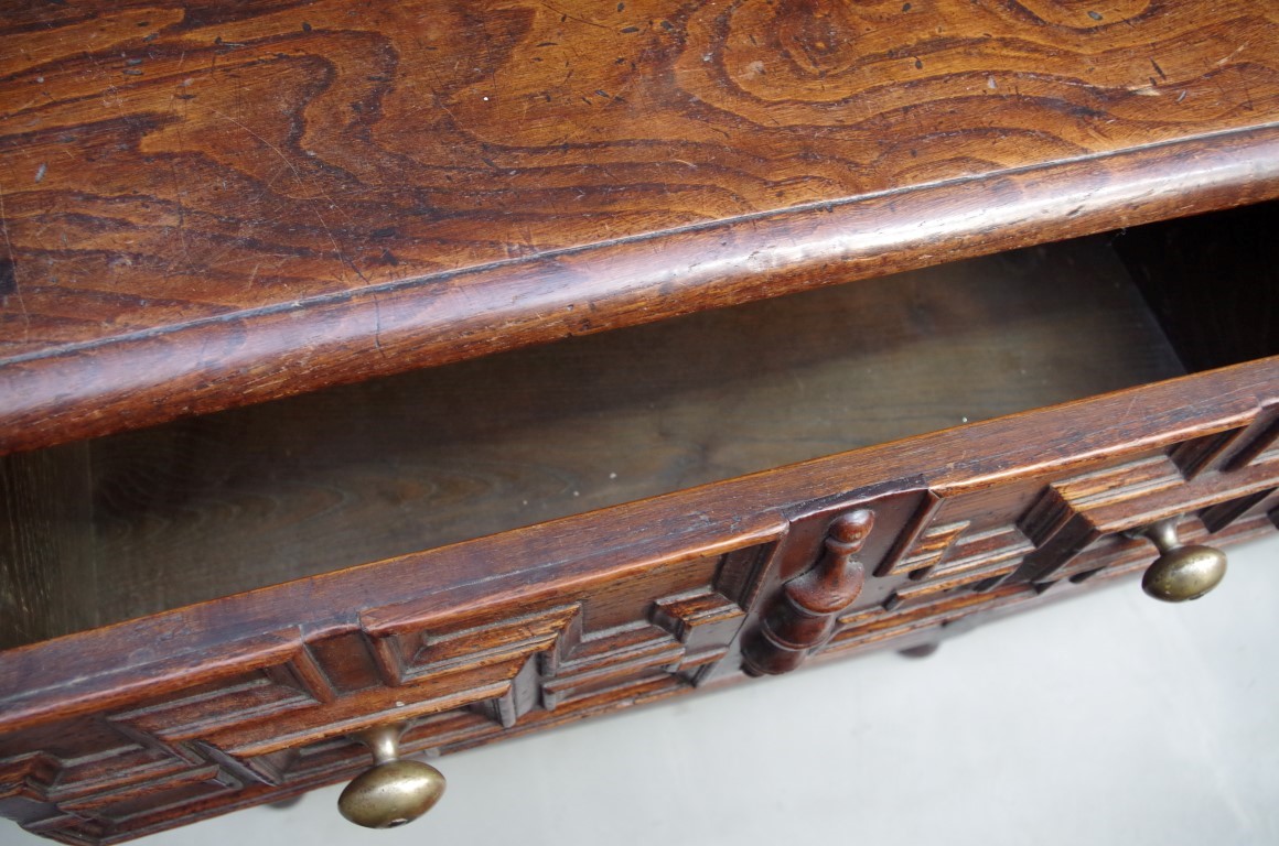 An 18th century oak dresser base, with geometrically moulded frieze drawers above reel turned legs - Image 4 of 6