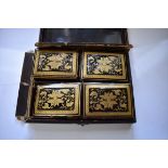 A 19th century Chinese export lacquered papier mache rectangular box, the hinged lid enclosing