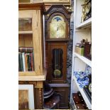 A reproduction oak longcase clock, the brass dial with moon phase arch, 201cm high, with three