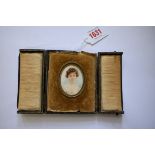 English School, early 20th century, head and shoulders portrait miniature of a lady, monogrammed,