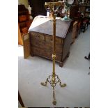 An old brass tripod standard oil lamp stand.