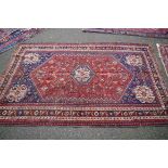 A Persian rug, with central floral medallion and floral, tree and animal design with floral and
