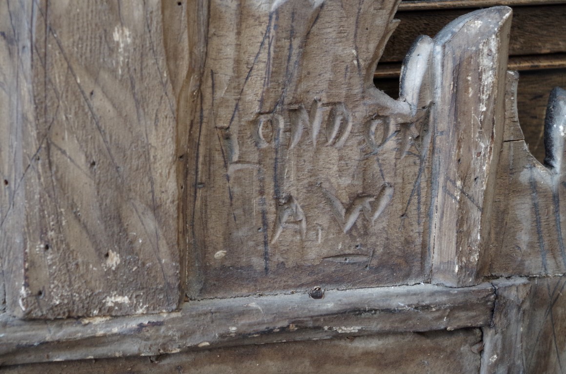 An antique walnut and faux grained wall mirror, 66.5 x 38.5cm, impressed markings verso. - Image 3 of 4