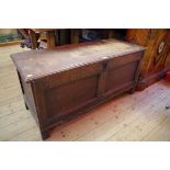 A late 17th/early 18th century oak panelled coffer, 125cm wide.