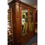 An impressive mahogany and inlaid double wardrobe, 189.5cm wide.