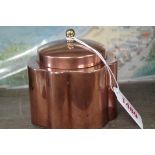 An early 20th century copper tea caddy and cover, by Joseph Heinrichs, with brass finial, 9cm high.