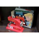 A vintage Vulcan Minor child's sewing machine, boxed.