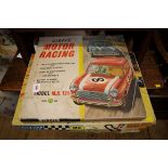 A Scalextric Team Set 35, boxed; together with an Airfix 'MR 125' motor racing set, boxed.