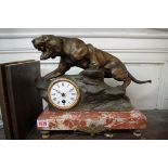 A bronzed spelter and marble figural mantel clock, 30cm high, with pendulum and winding key.