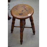 An elm, ash and fruitwood stool.