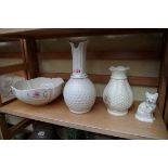 Three items of Belleek, largest 27cm high; together with a similar Donegal vase.