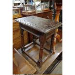 An antique oak joint stool, 48cm wide.