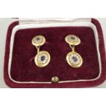 A pair of oval unmarked yellow metal sapphire and diamond set cufflinks, 8.6g all in.