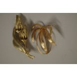 A gold lily spray brooch, by Zeeta; together with another gold brooch, both stamped either 9ct or .