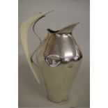 A stylish Spanish silver water jug, 28cm tall.