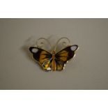 A Norwegian enamelled silver gilt butterfly brooch, by David Anderson, 3cm across.