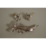 A floral spray white sapphire brooch; together with a pair of white sapphire and pearl earrings.