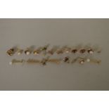 Eleven pairs of various earrings, stamped either 9ct or .375.