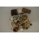 A small bag of costume jewellery, to include brooches; beaded necklaces etc.