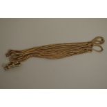 A gold longuard chain, marked 9c, having metal clasp, 153cm long, 26.8g all in.