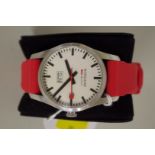 A Mondaine Railways stainless steel gentlemans wristwatch, 34mm case, having red rubber strap and