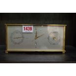 A vintage Luxor combined desk clock, barometer and thermometer, retailed by Asprey, 18.5cm wide.