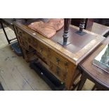 A 1920s oak kneehole desk, 107cm wide.