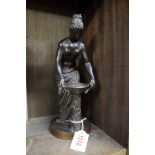 An antique bronze figure of a classical female, 27cm high.