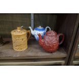 A Staffordshire Redware teapot and cover, relief moulded with leaves, 11cm high; together with a