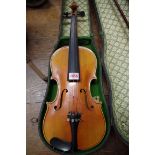 A late 19th century Continental violin,Â labelled 'Nach Amati Erzeugt von C F Schuster & Sohn', with