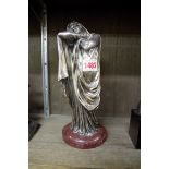 An Art Deco silvered bronze figure of a robed lady,Â on marble base, total height 26.5cm.