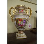 A Victorian Derby porcelain twin handled urn, painted with floral panels, 27.5cm high.