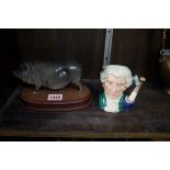 A Royal Doulton sow on wood stand; together with a Royal Doulton small character jug.