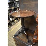 An 18th century mahogany tilt-top piecrust tripod table,Â 51.5cm diameter.