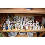 A collection of ceramic shoe models; and other similar.