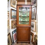 A 19th century mahogany and line inlaid standing corner cupboard, with glazed upper section, 76cm