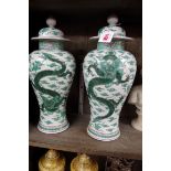 A pair of Samson famille verte inverted baluster vases and covers,Â 17.5cm high.