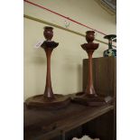 An interesting pair of Arts and Crafts oak octagonal candlesticks, with plated metal sconces, 32.5cm