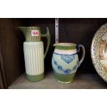 A Macintyre pottery jug,Â 16.5cm high; together with another Macintyre 'Taluf Faience' jug, 24cm