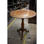 A Victorian mahogany and chequerboard inlaid circular tripod table, 61cm diameter.