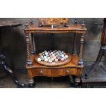 A Victorian rosewood two tier whatnot, with apron drawer, 61cm wide, (reduced in height).