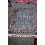 A Persian rug,Â having repeated design to central field with allover geometric decoration on a