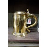 An 18th century gilt metal tankard, 18.5cm high.