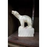 An Art Deco carved figure of an alabaster polar bear on iceberg,Â 21cm high.