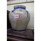 A Chinese pottery jar and cover, seal mark to base, 26cm high.