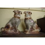 A pair of Staffordshire pottery pugs, with glass eyes, 30.5cm high, (one repaired).