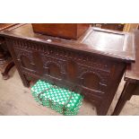 A late 17th century carved oak panelled coffer,Â 115cm wide.