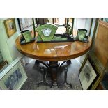 A mahogany and rosewood circular breakfast table, 127cm diameter, (top and base associated).